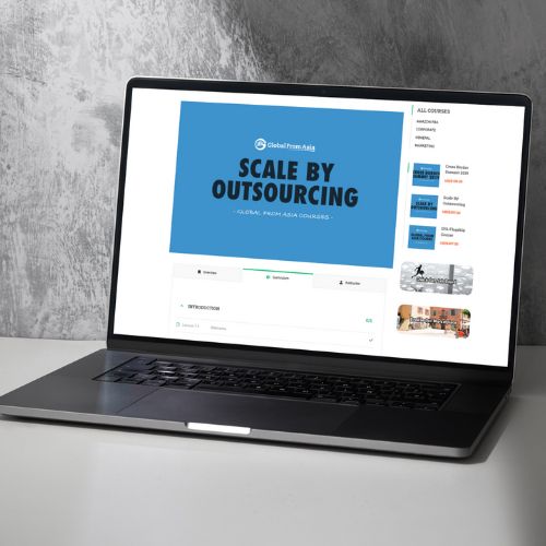 Scale By Outsourcing course on a laptop